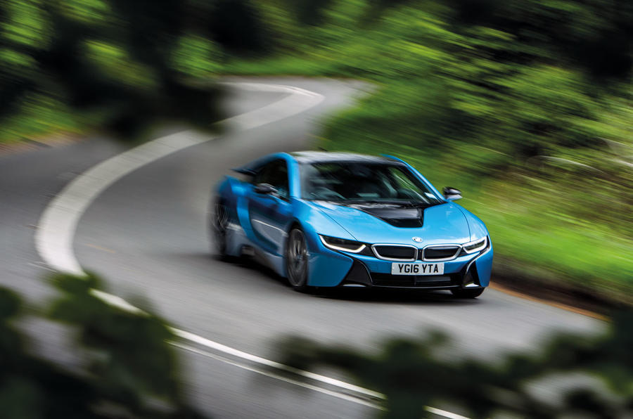 blue bmw i8 taking corner at speed