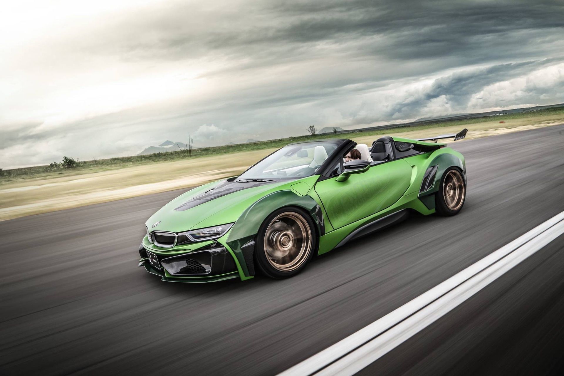 green bmw i8 roadster convertible with bodykit